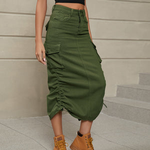 Army green cargo denim midi skirt with adjustable ruching detail and button flap pockets.
