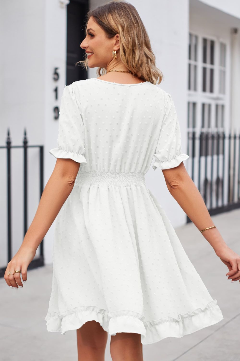 White textured dot puff sleeve fit-and-flare dress with smocked waist and ruffled hem