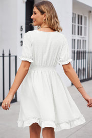 White textured dot puff sleeve fit-and-flare dress with smocked waist and ruffled hem