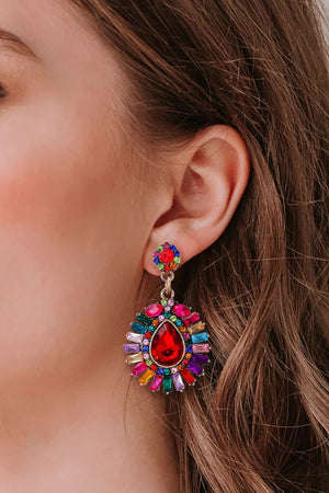 Multicolor dangle earrings with a large red teardrop gem and surrounding colorful baguette gems.