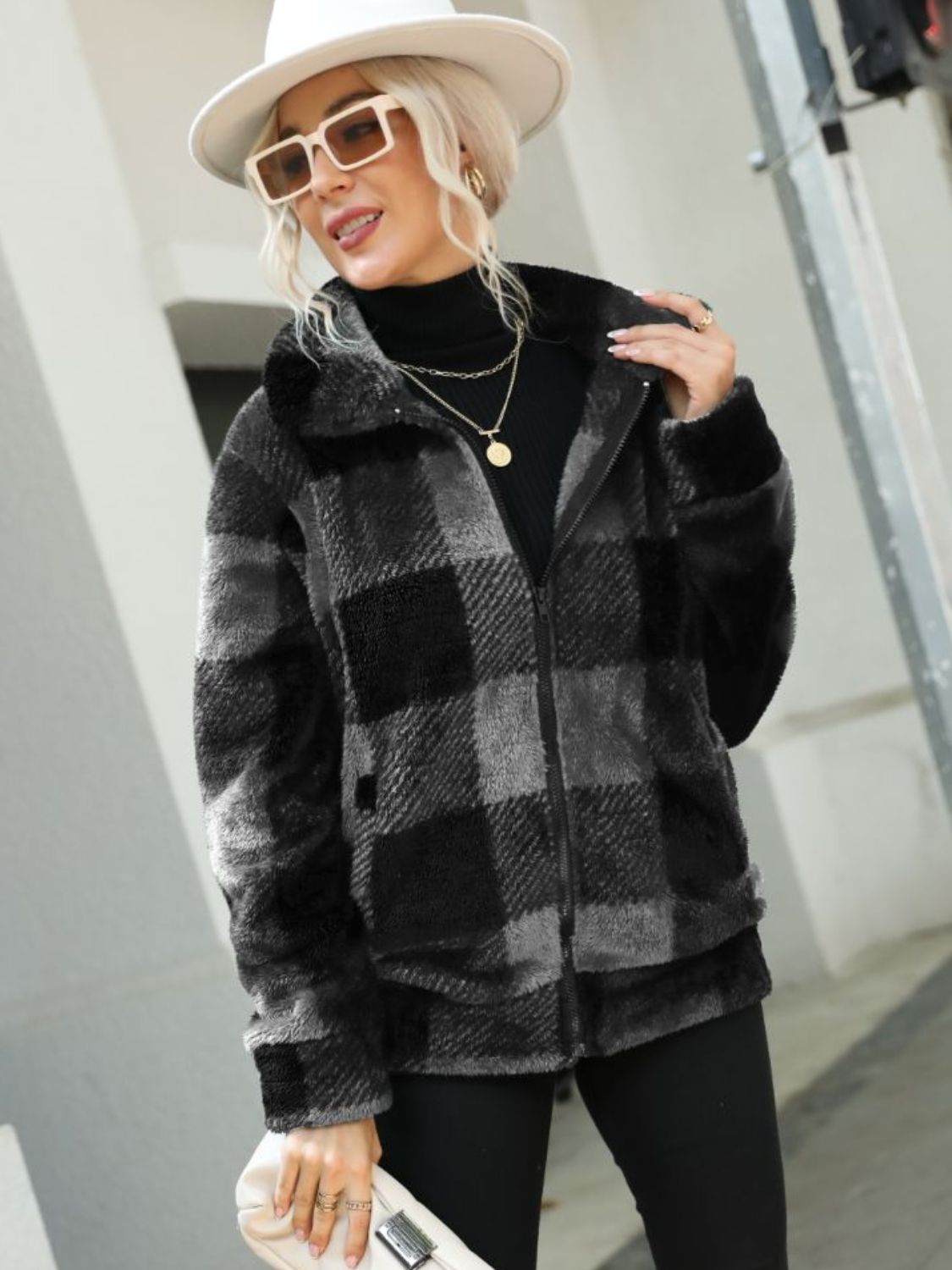 Charcoal plaid sherpa zip-up jacket with collared neckline and fuzzy texture.