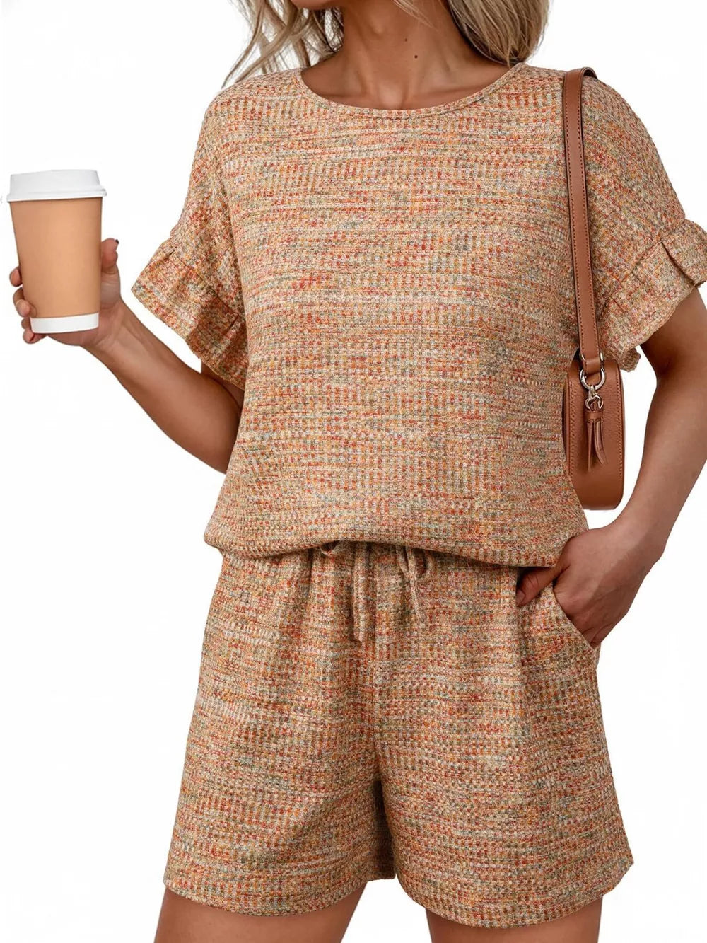 Orange-red tweed two-piece set with ruffled sleeves and drawstring shorts.