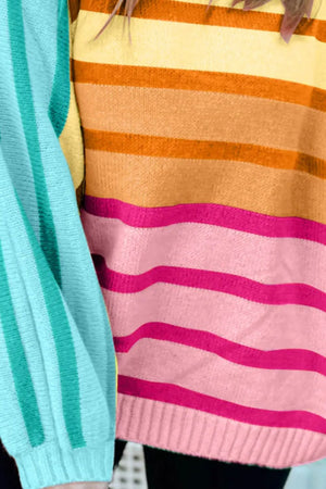 Ombre stripe knit sweater with ribbed cuffs in Sherbet and Turquoise colors.