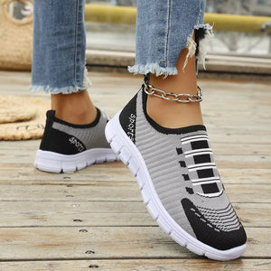 Round Toe Slip-ons in Black, model styling view