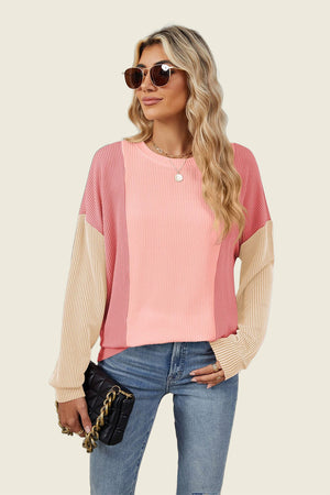 Colorblock waffle knit pullover sweater in pink and tan with crew neck and long sleeves.