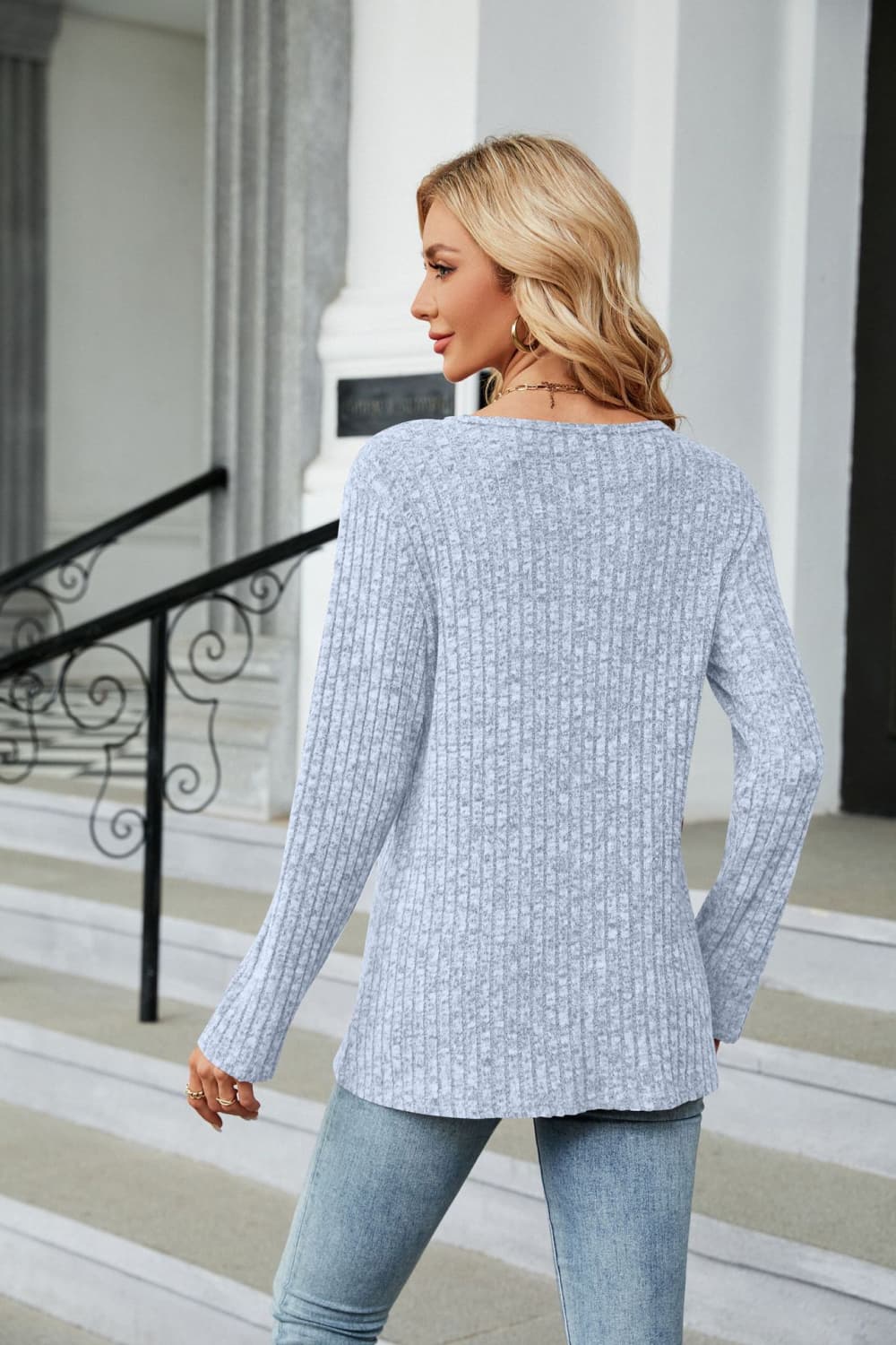 Light Blue ribbed tunic top with button detail and asymmetric hem, long sleeves.