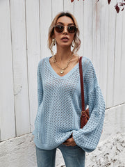Open-knit sweater in Misty Blue with V-neck and balloon sleeves.