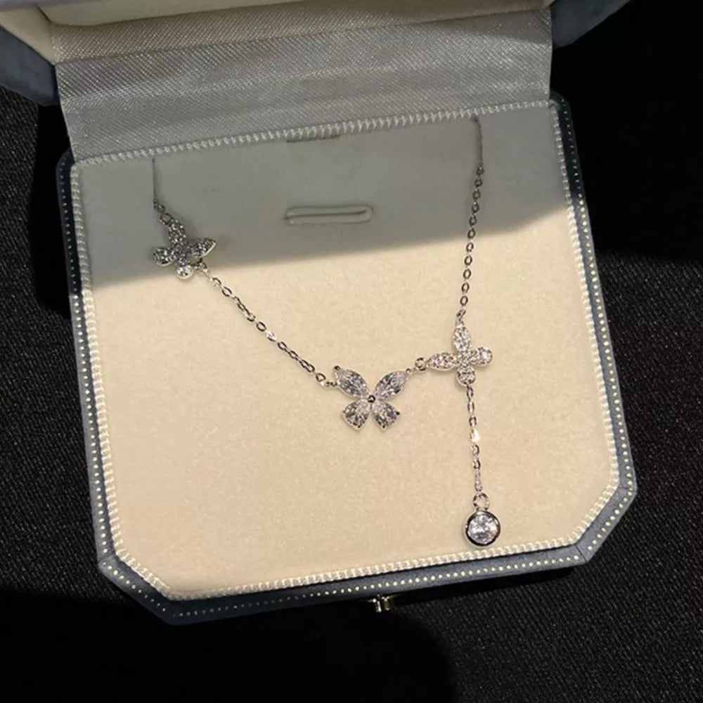 Elegant butterfly zircon necklace in silver sterling with a dangling charm.