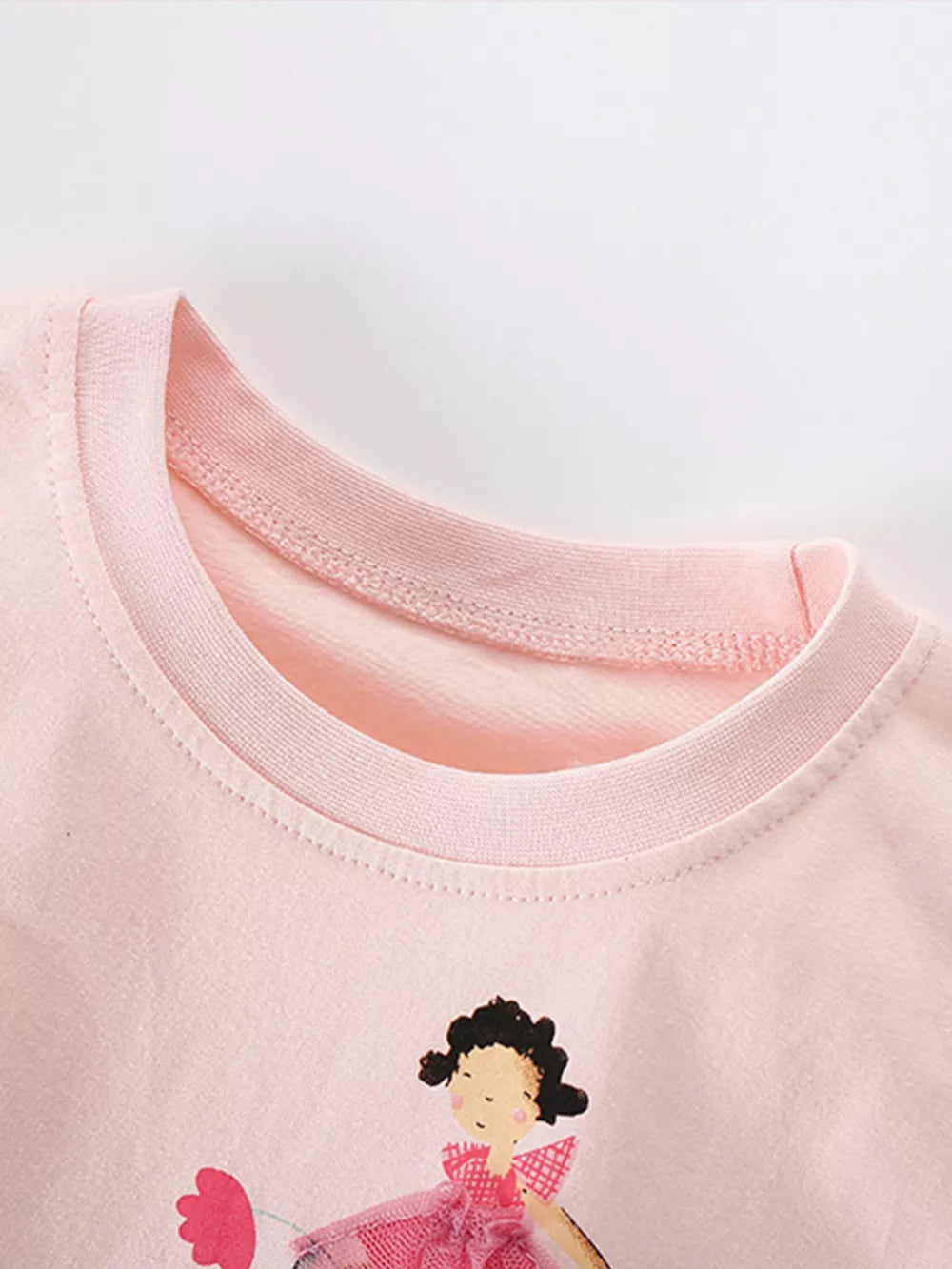 Pink cotton toddler tee with ballet dancer graphic and mesh tutu detail.