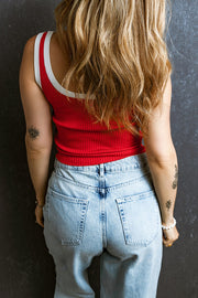 Scarlet ribbed tank top with white contrast trim neckline and armholes