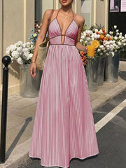 Burgundy striped halter maxi dress with plunging neckline and a-line skirt.