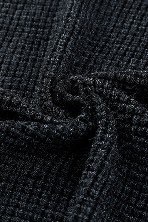 Textured black acrylic knit cardigan detail