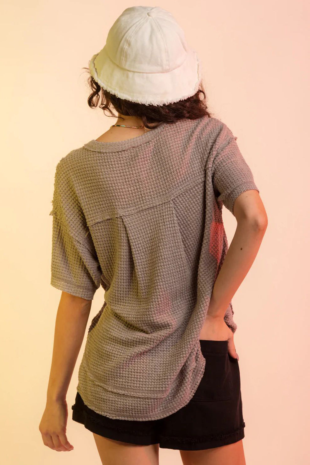 Taupe waffle knit relaxed fit v-neck top with short sleeves and raw edge detail