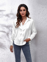 White satin collared button-down shirt with long sleeves and a relaxed fit.