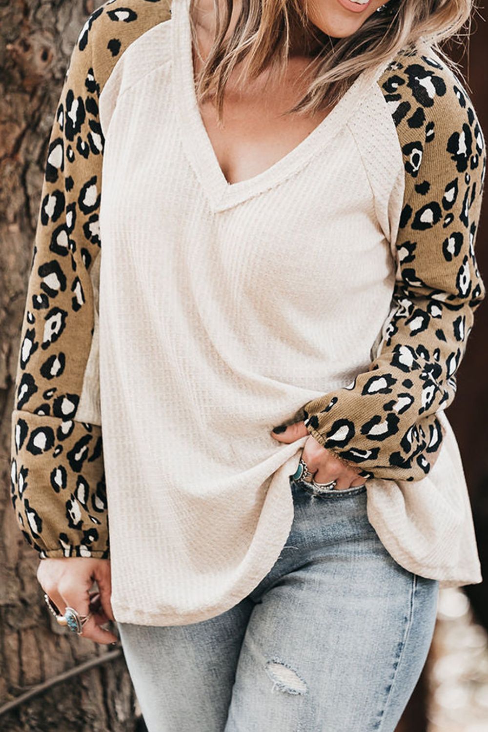 White waffle knit top with leopard print sleeves and V-neck