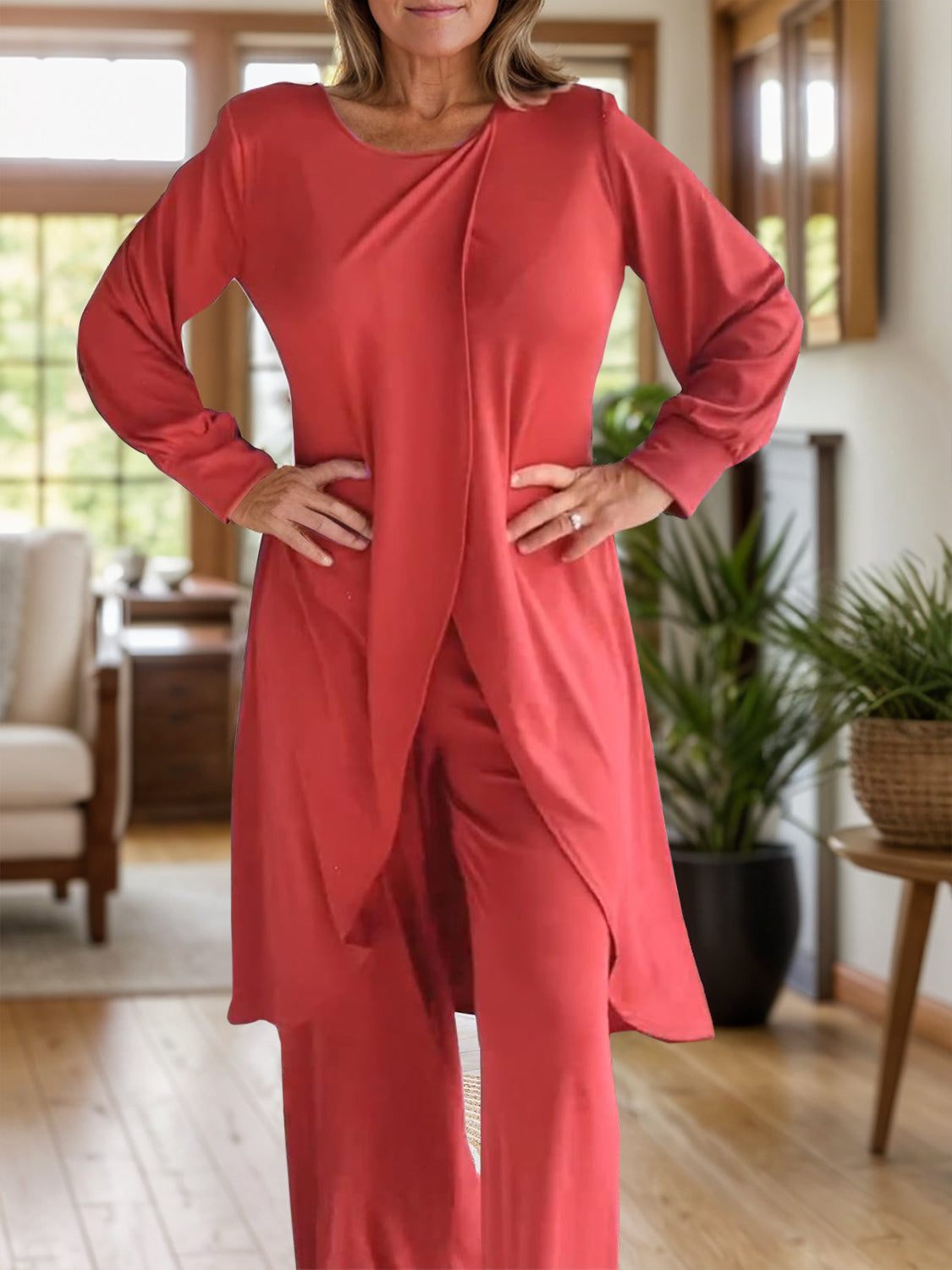 Orange-red draped overlay palazzo co-ord set with long sleeves and wide-leg pants.