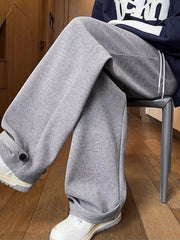 Relaxed fit grey herringbone sweatpants with drawstring and ankle cuffs.