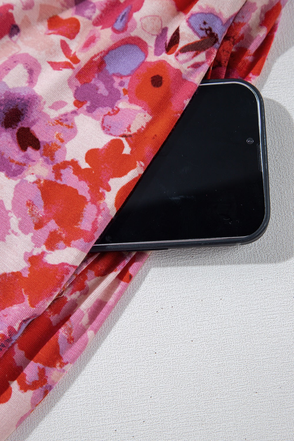 Painterly floral palazzo trousers in strawberry with a pocket detail.