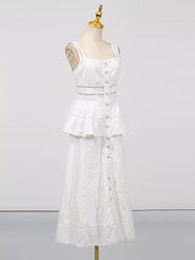 White eyelet embroidered midi dress with button front, tiered ruffle, and cutout waist detail.
