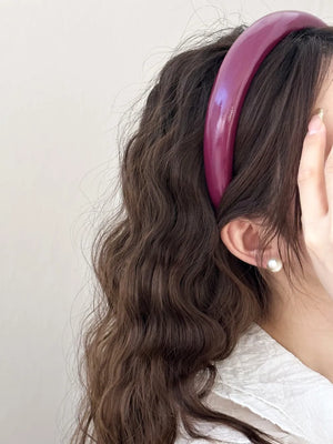 Glossy padded headband in deep purple, a chic hair accessory for adults.