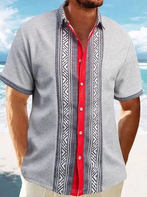Gray textured Cuban shirt with red placket and geometric panel detail.