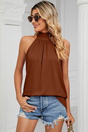 Caramel high neck halter tank top with ruched detail and bow back.