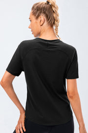 Black performance raglan crew neck tee with short sleeves and curved hem