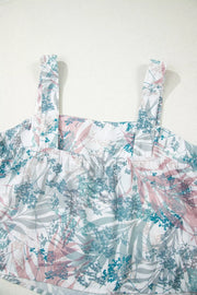 Botanical print maternity one-piece swimsuit with adjustable straps and smocked neckline.