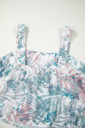 Botanical print maternity one-piece swimsuit with adjustable straps and smocked neckline.