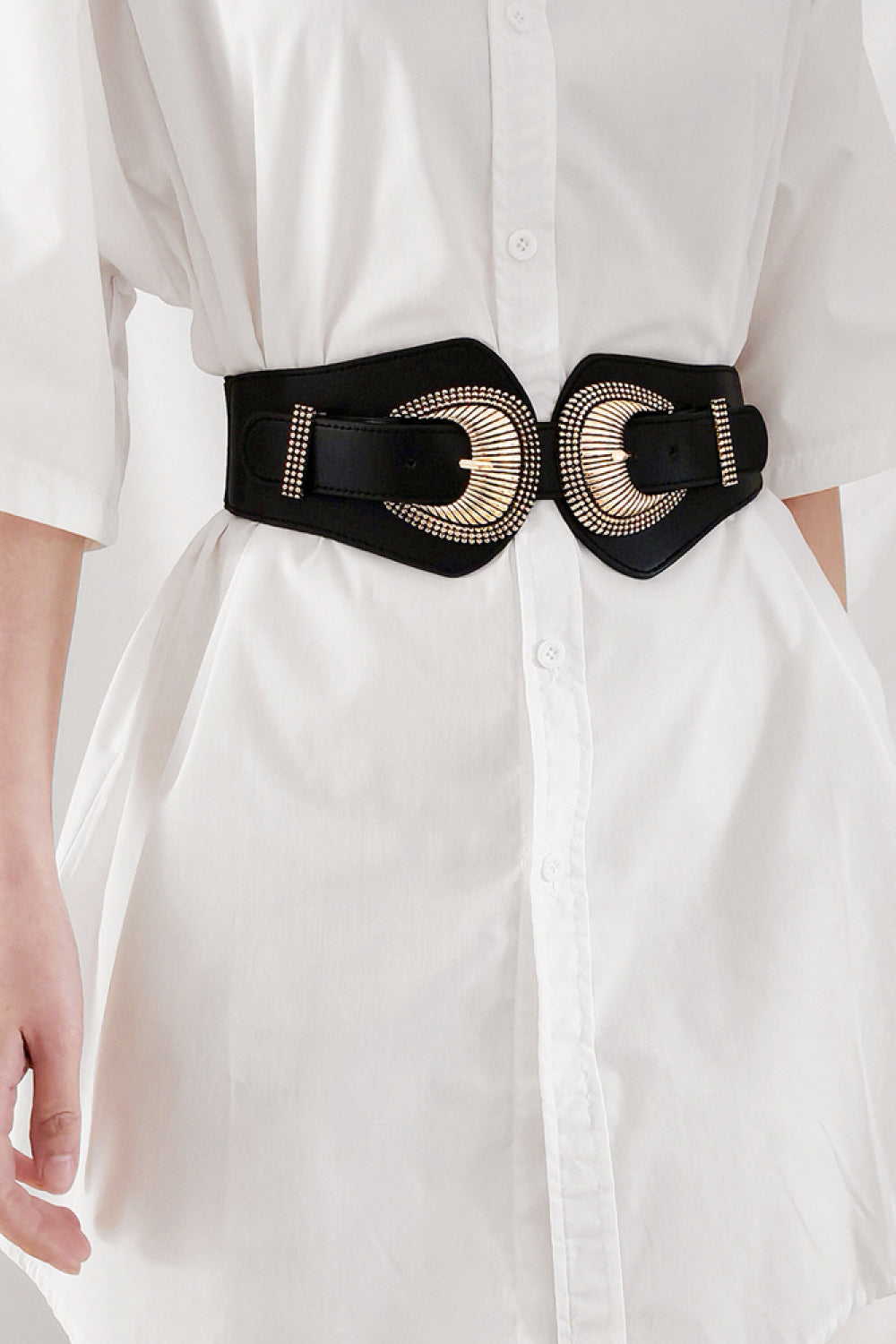Black elastic corset belt with sculpted gold double buckle and stud detail
