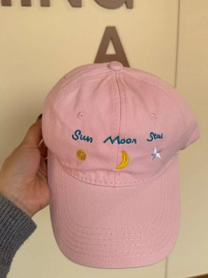Blush Pink cotton baseball cap with celestial embroidery of sun, moon, and star.