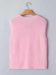 Pink acrylic V neck sweater vest with button front detail.