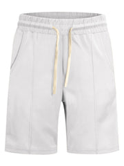 White chino shorts with drawstring waist and front pockets.