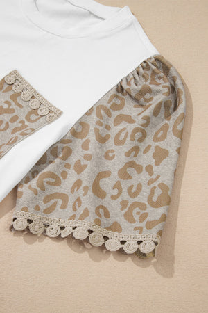 White cotton t-shirt with leopard print sleeves and lace trim.