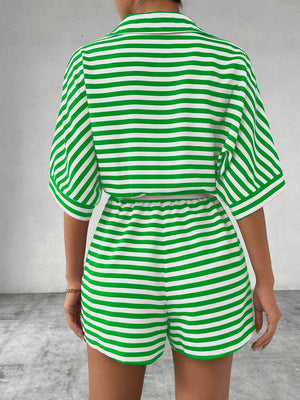 Green and white striped romper with short sleeves and elastic waist shorts.