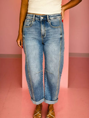 Vintage-inspired high-waisted seam jeans in light wash denim with cuffed hems.