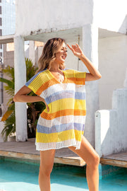 Rainbow crochet beach cover-up with V-neck and short sleeves, featuring horizontal stripes in yellow, orange, white, and