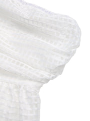 White strapless mini dress with airy grid pattern fabric and cinched waist detail.
