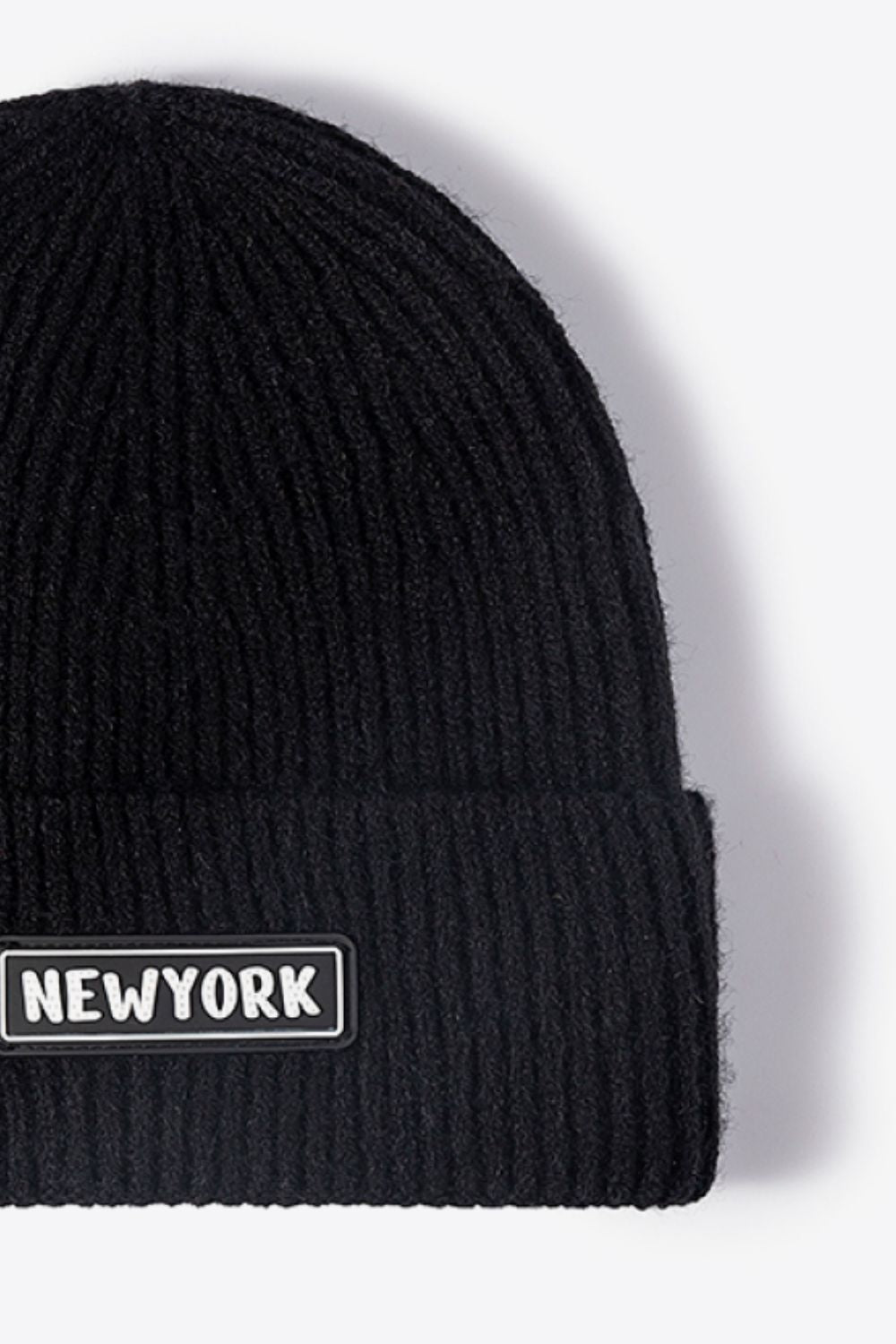 Black ribbed acrylic beanie with New York patch detail