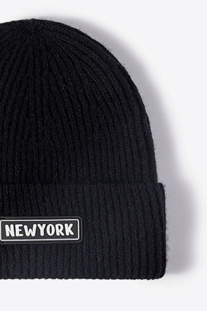 Black ribbed acrylic beanie with New York patch detail