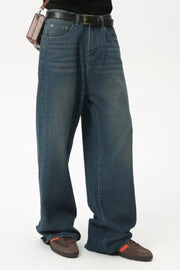 Baggy denim jeans in medium wash with subtle fading and a relaxed fit.
