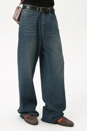 Baggy denim jeans in medium wash with subtle fading and a relaxed fit.