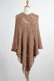 Camel crochet poncho with intricate open knit pattern and fringe detail