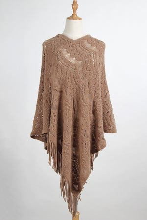 Camel crochet poncho with intricate open knit pattern and fringe detail