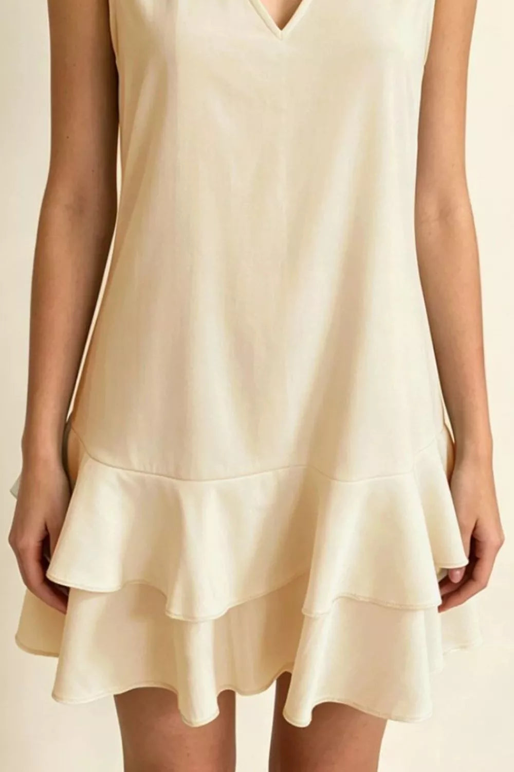 Beige V-neck mini dress with tiered ruffle hem, sleeveless, polyester