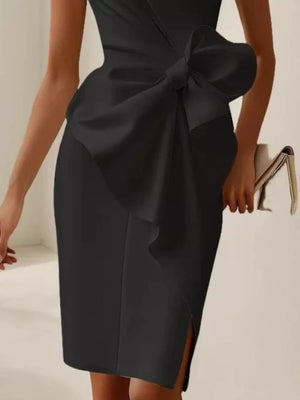 Black sleeveless dress with a large bow detail and side slit