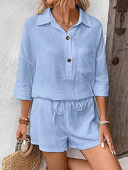 Sky blue cotton two-piece set with drawstring shorts and button-up shirt.