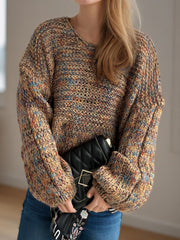 Textured knit sweater with balloon sleeves in a multicolor yarn, featuring a V-neck.