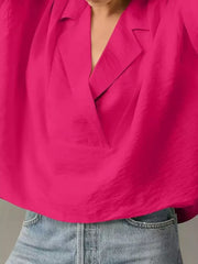 Hot pink V-neck half sleeve shirt with a relaxed fit, styled with denim.