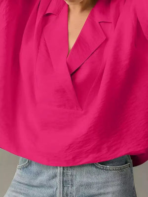 Hot pink V-neck half sleeve shirt with a relaxed fit, styled with denim.
